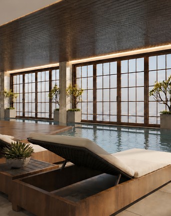 Indoor pool with loungers at Aviva by Vivere
